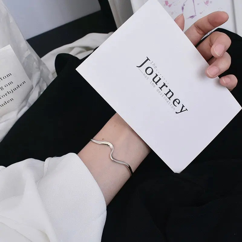 WAVE SILVER BANGLE Mira Gemini